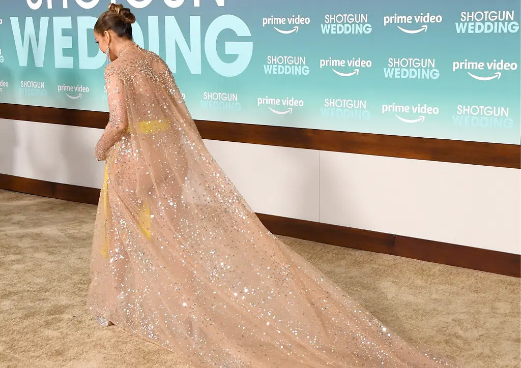 Jennifer Lopez Wearing a Sheer nude Valentino gown embellished with stunning crystal detailing